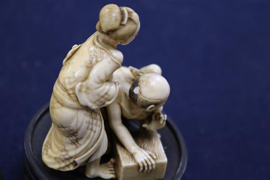 A good Japanese ivory okimono of the Rat Catcher and a figure of a man, both Meiji period